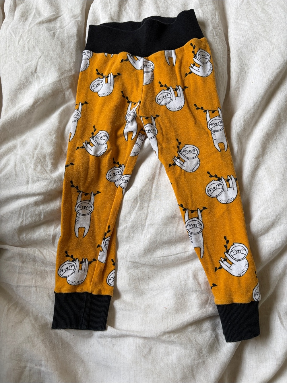 Kids Mustard Yellow Sloth Print Pajama Bottoms with Black Trim
